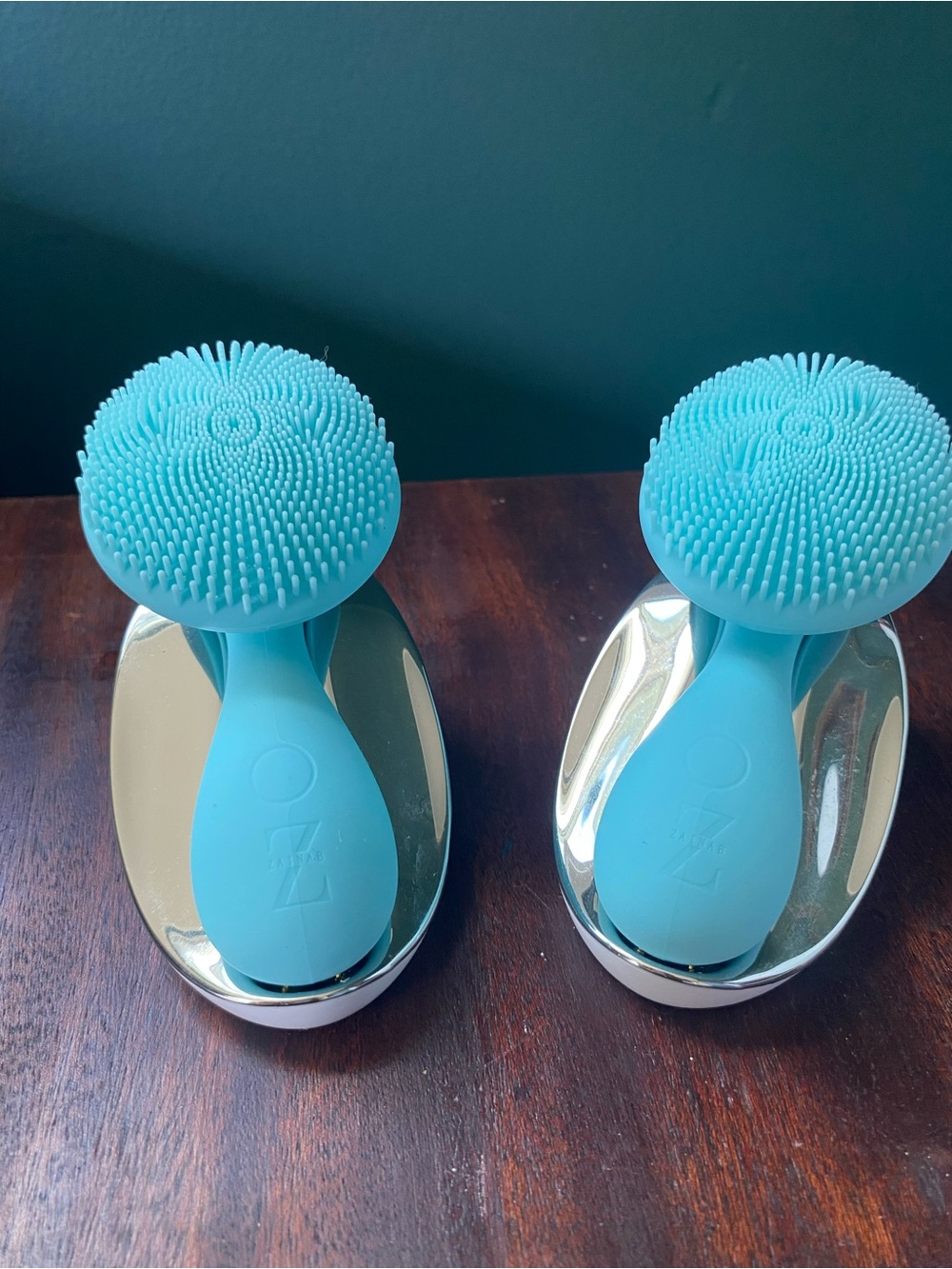 Pair of Aqua Silicone Facial Cleansing Brushes with Metallic Stands